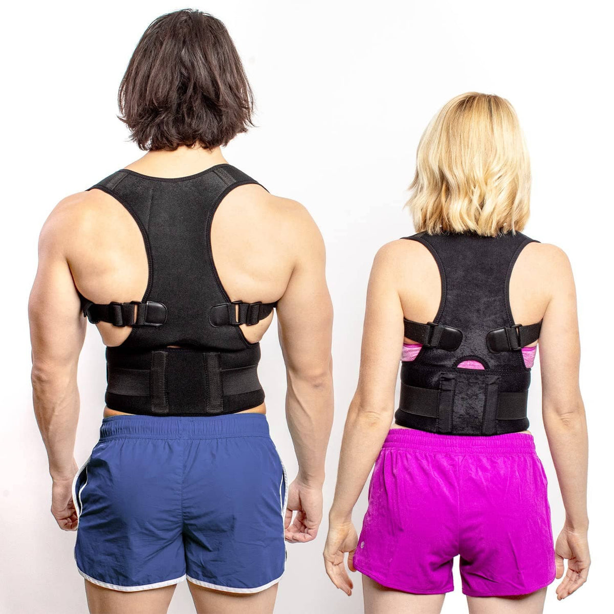 Black posture corrector back brace with padded panel and adjustable shoulder straps.