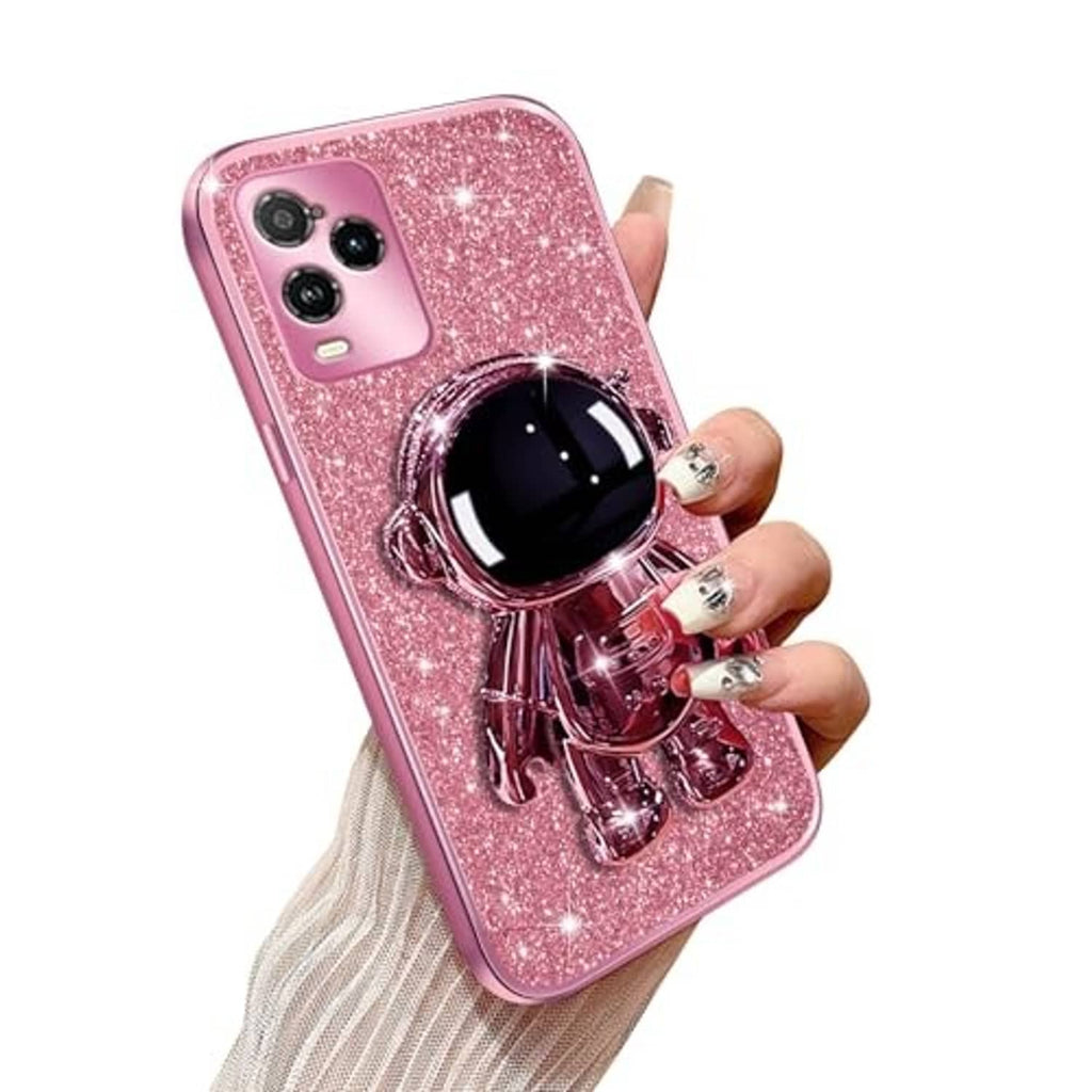 Rose gold glitter phone case with astronaut kickstand, phone held in hand
