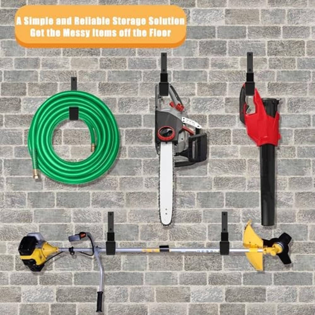 Black wall hooks for hanging tools and hose on a brick wall, with mounting bases