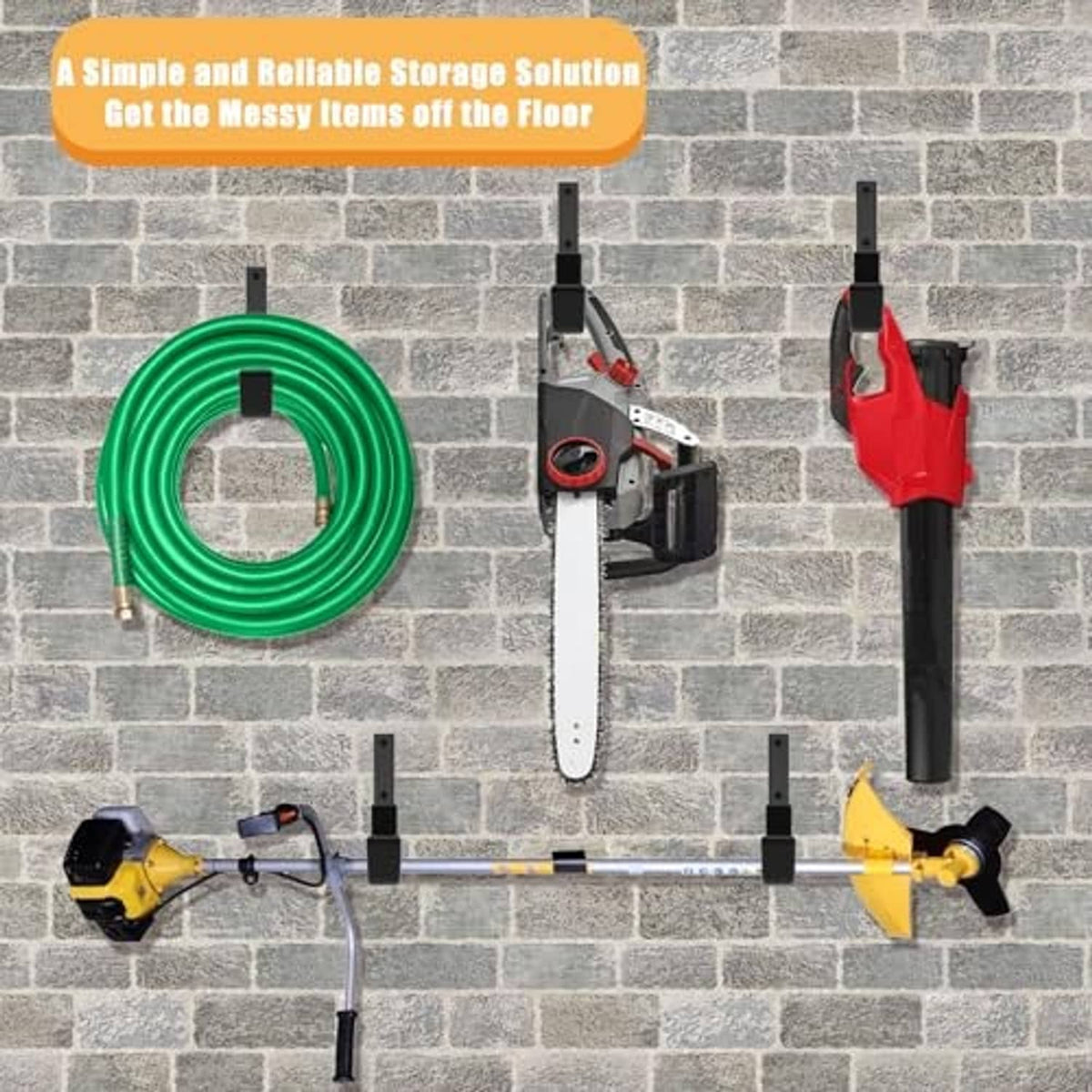 Black wall hooks for hanging tools and hose on a brick wall, with mounting bases