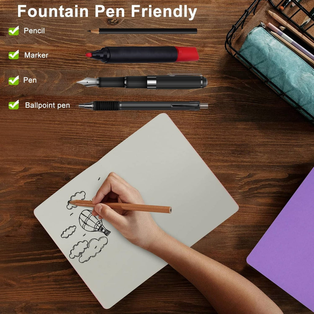 A5 blank notebook with fountain-pen friendly paper, hand writing on a sketch page