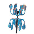 Blue metal wind spinner with curled petal blades on a black stake