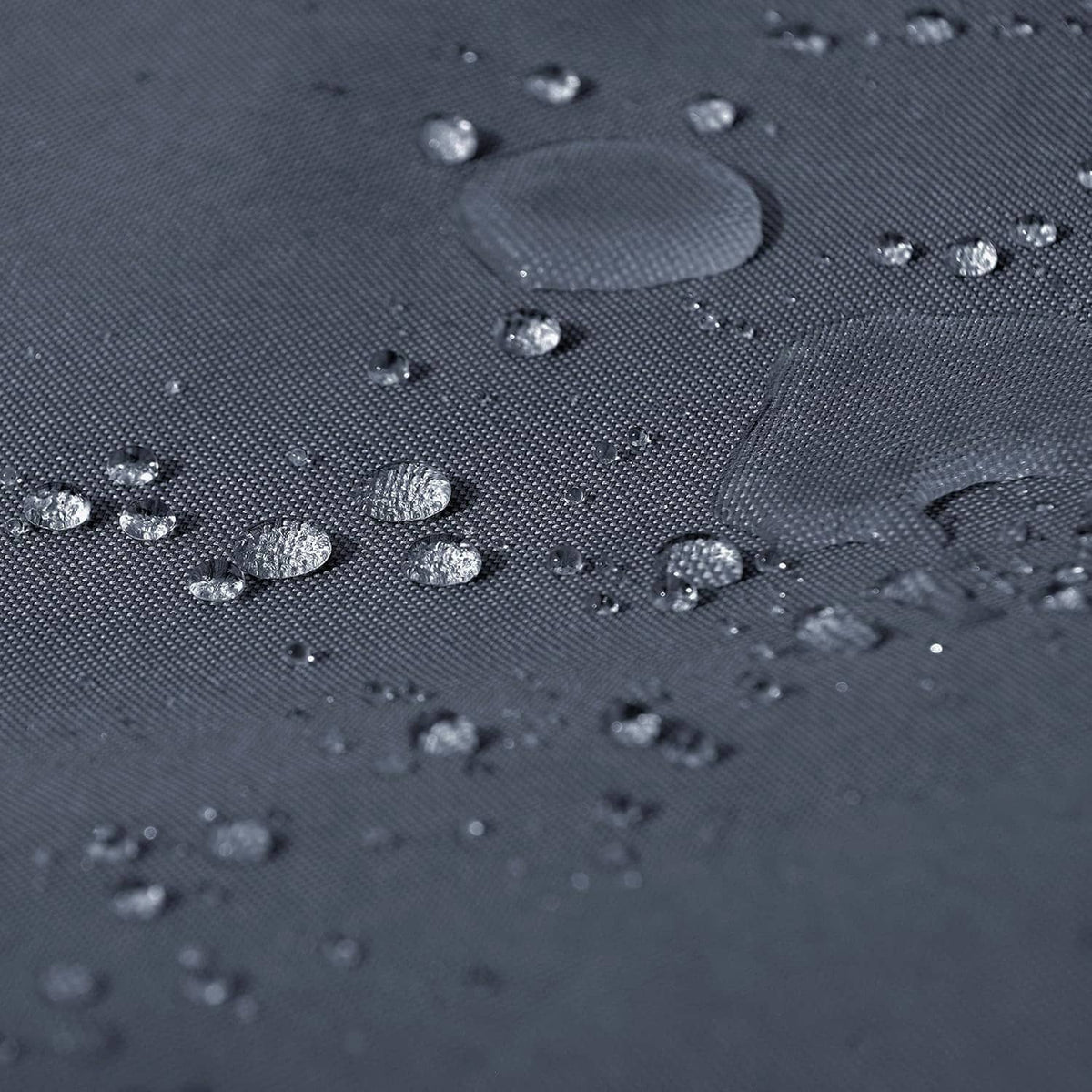 Waterproof hot tub cover fabric with water beads on textured dark gray surface