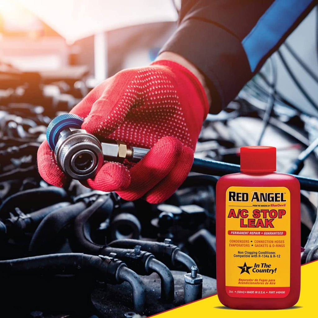 Red Angel A/C Stop Leak bottle with mechanic gloved hand by car engine.