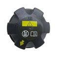 Expansion tank cap with grey plastic body and yellow warning label panel