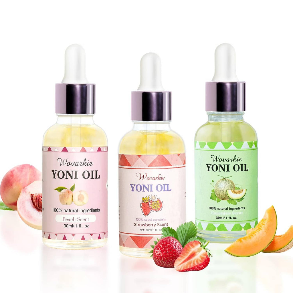 Three feminine oil dropper bottles with pastel labels in a close-up view