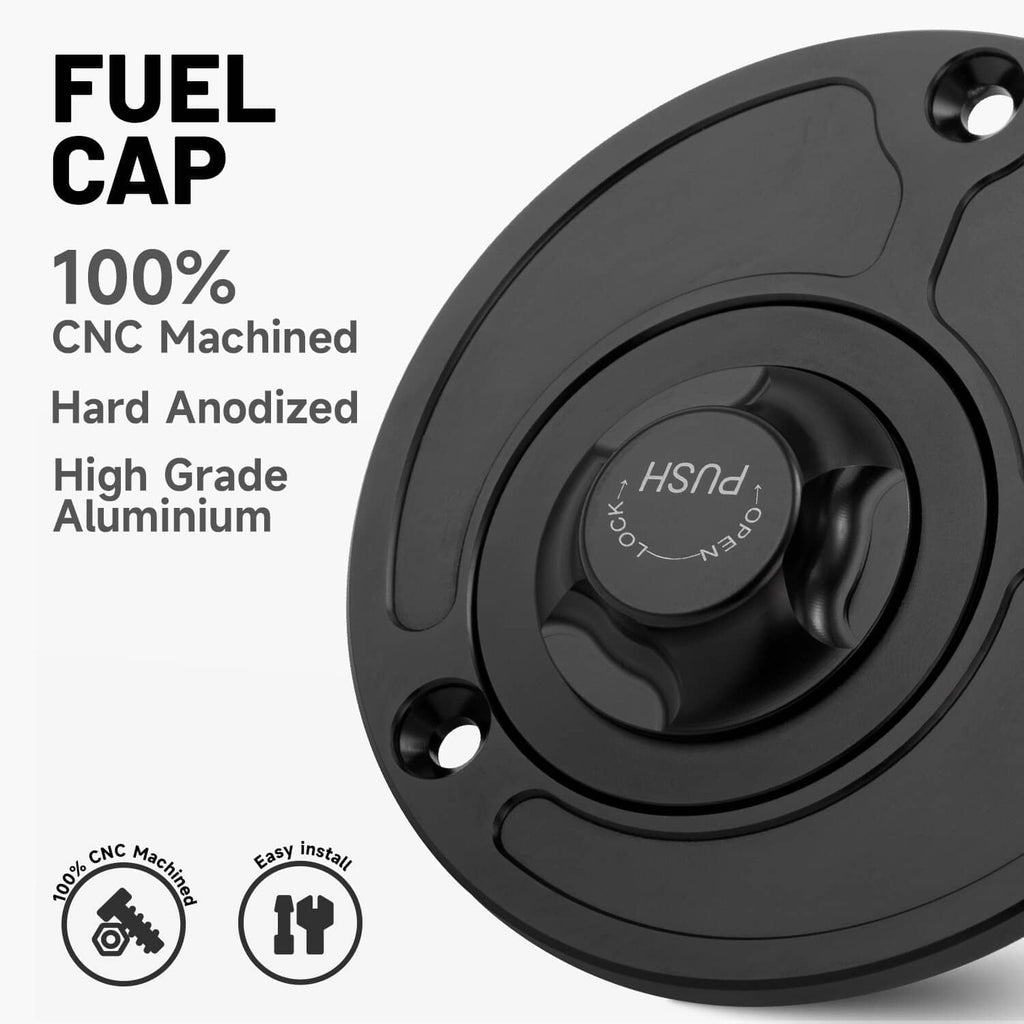 Black fuel tank gas cap angled view with push-to-lock center and mounting holes