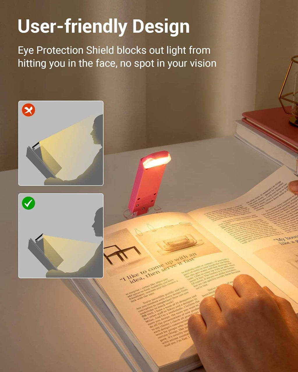Pink LED book light with glare-shield design, clipped to an open page