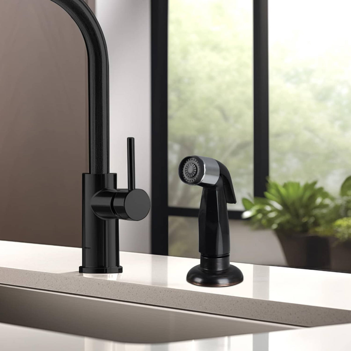 Matte black kitchen faucet setup with pull-down sprayer attachment