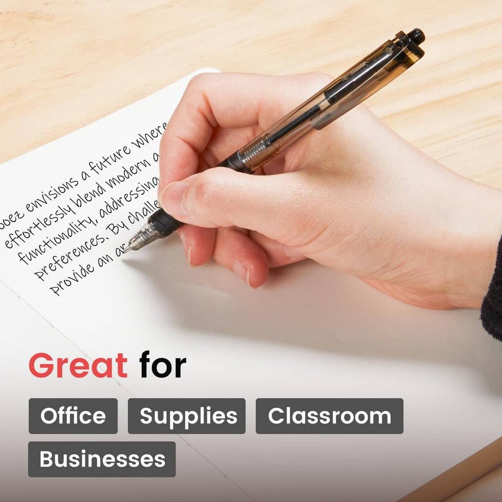 Black ballpoint pen in hand writing on a desk surface