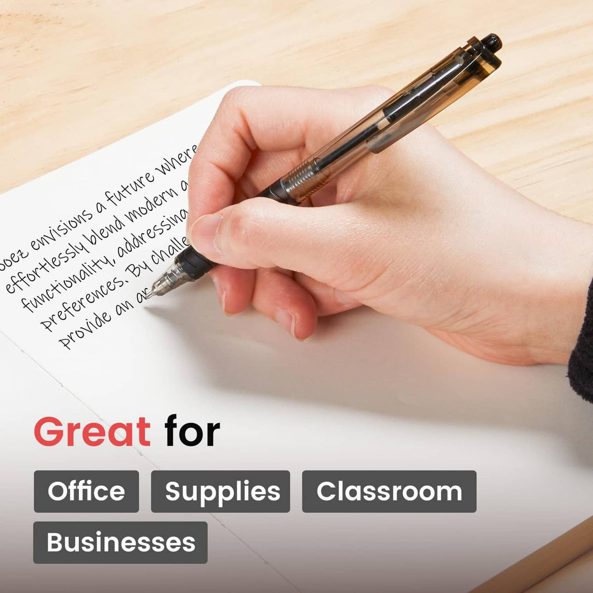 Black ballpoint pen in hand writing on a desk surface
