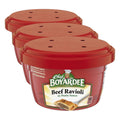 Microwaveable beef ravioli pasta sauce cups with red lids, 3-pack pictured