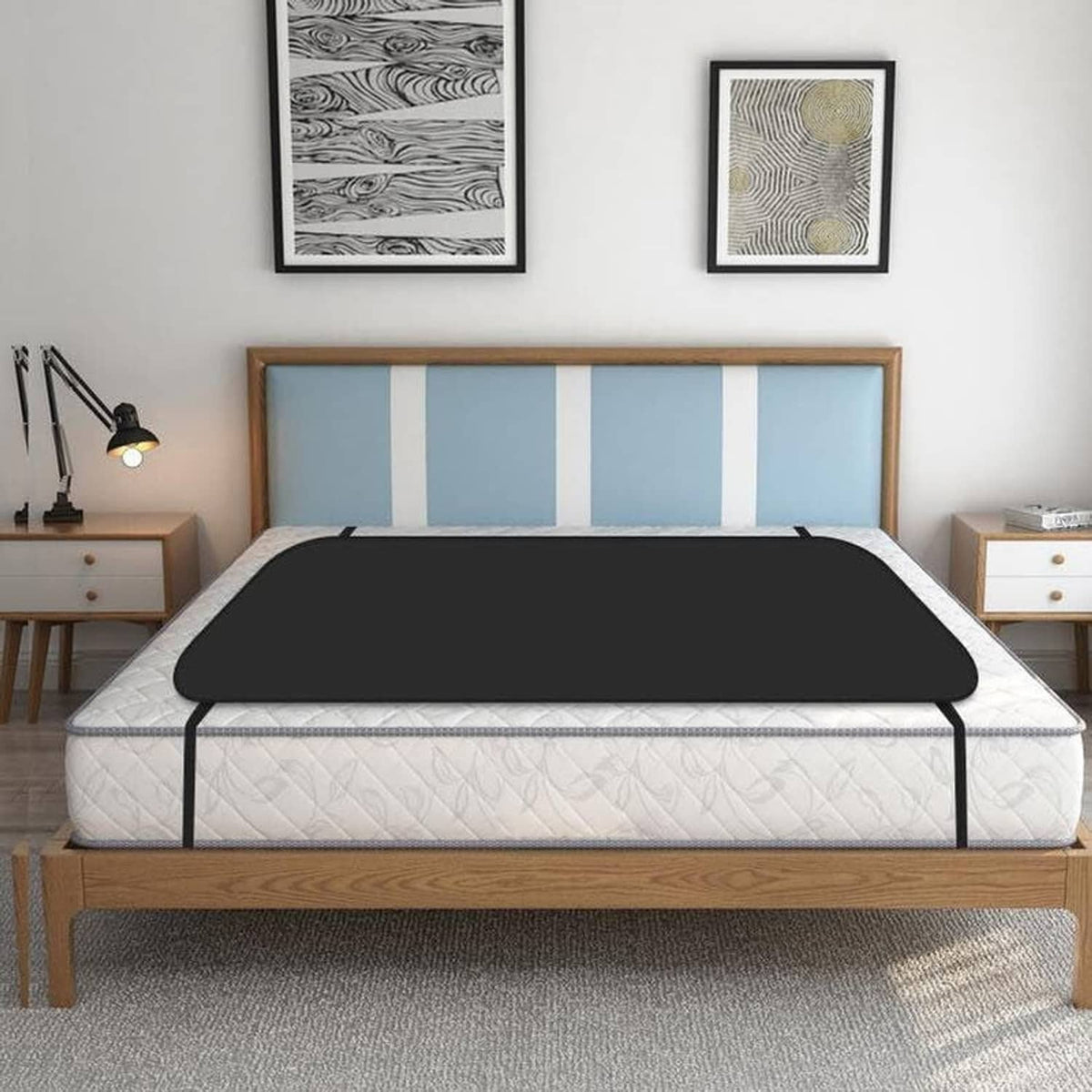 Grounding mattress pad with dark cover on bed base