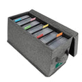 Gray fabric CD storage box with lid, open top showing multiple disc sleeves inside