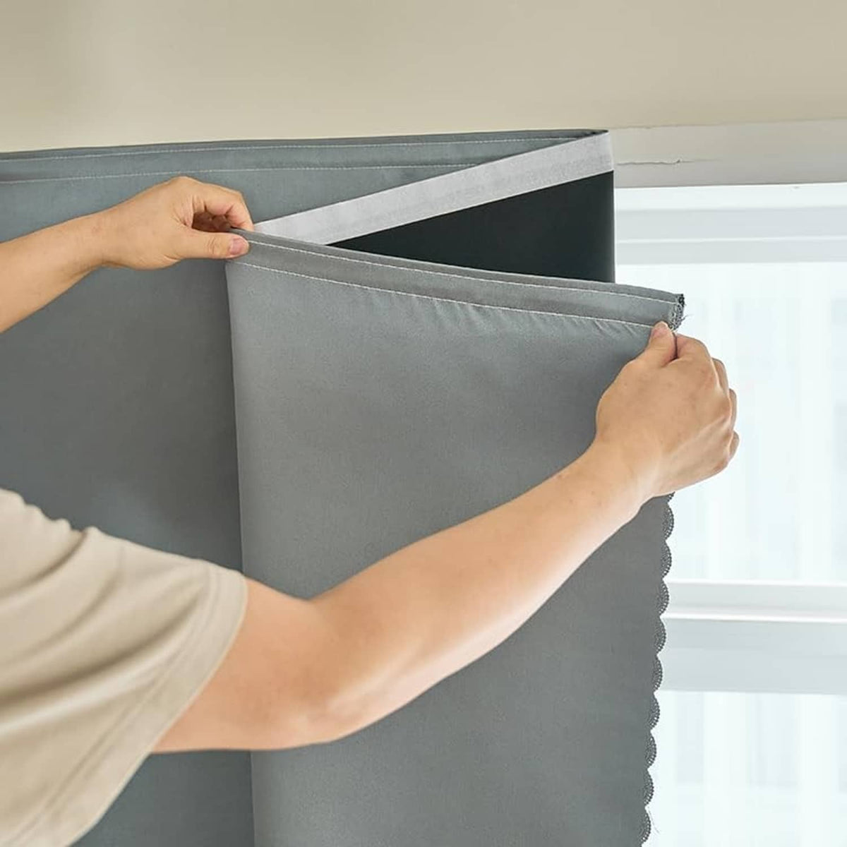 Self-adhesive blackout curtain panel in silver-gray with tape backing edge
