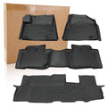 Black rubber floor liner mats set with raised edges and textured grip pattern