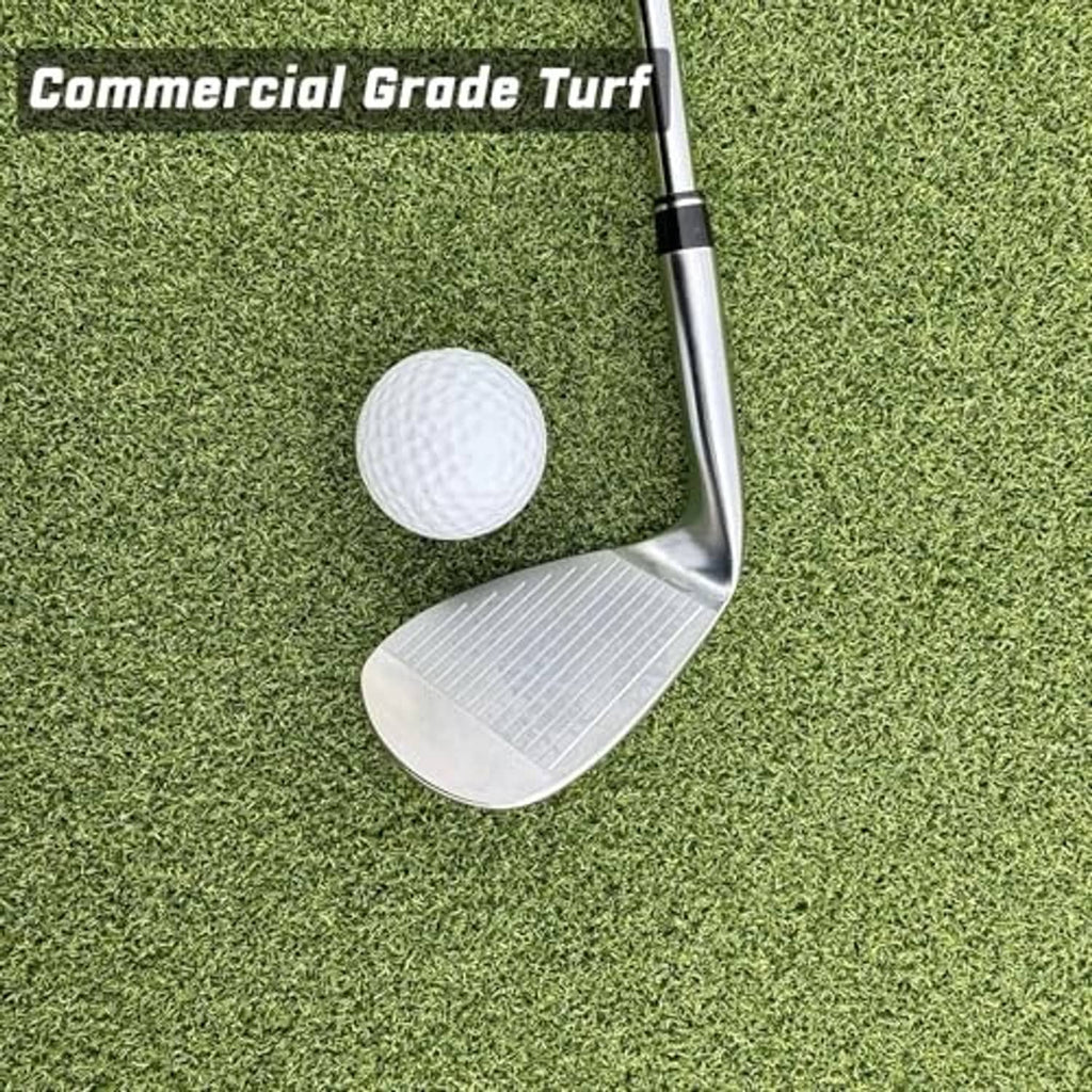 Green commercial golf turf with golf ball and club head on the hitting surface