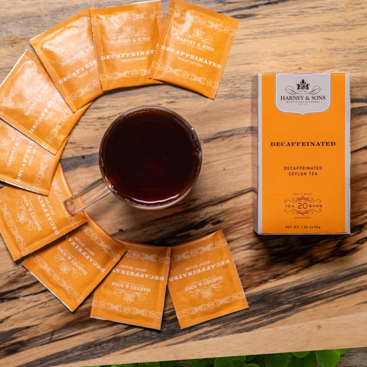 Decaffeinated Ceylon tea sachets on table with cup and tea box