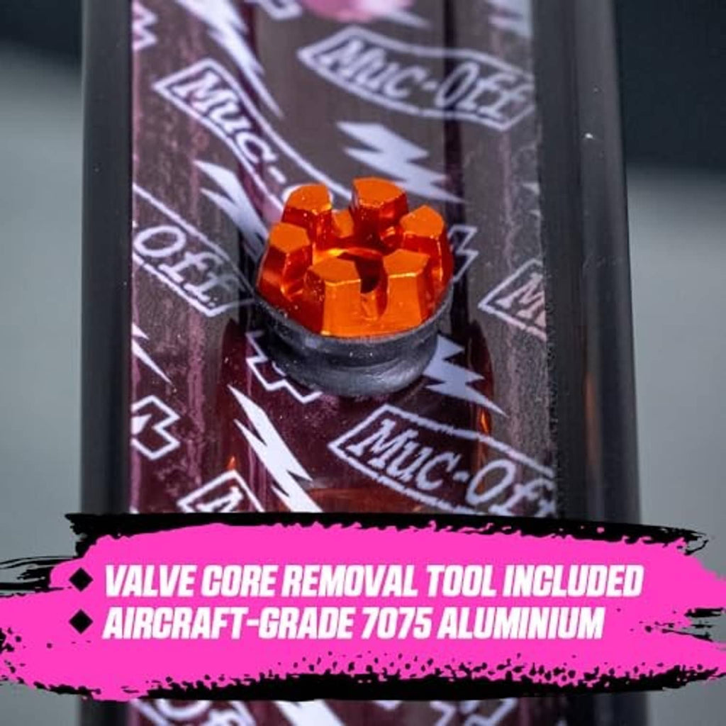 Orange Presta tubeless valve with included core removal tool and installed cap.
