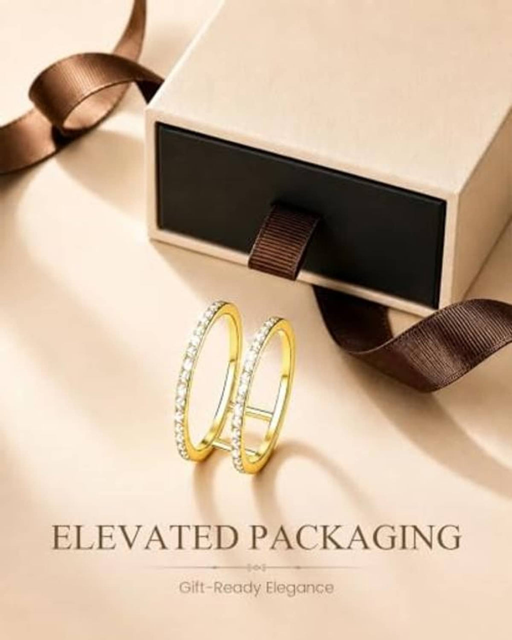 Gold smart ring jacket with pavé stones, shown beside gift box