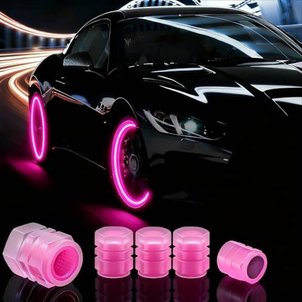 Pink glow-in-the-dark tire valve caps with a car wheel featuring bright neon rims