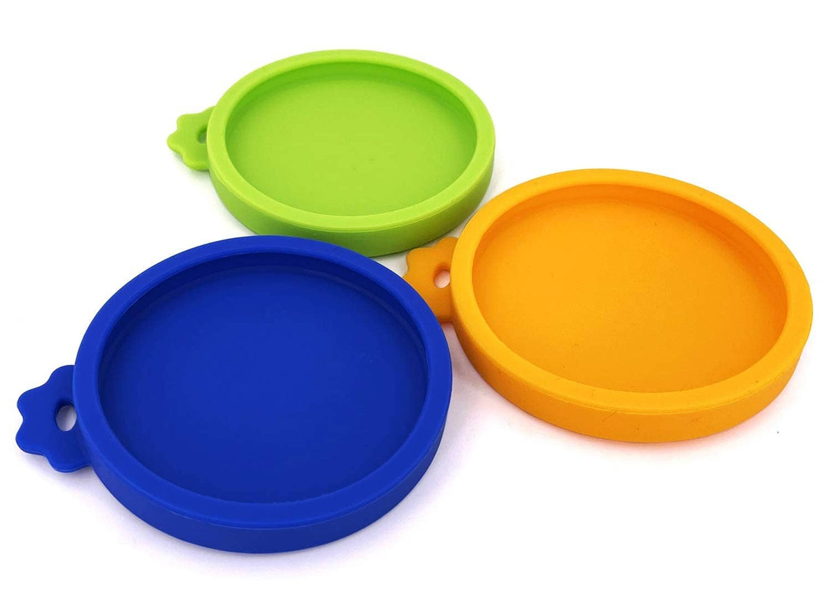 3 silicone pet food can lids in lime, blue, and orange, round cove style