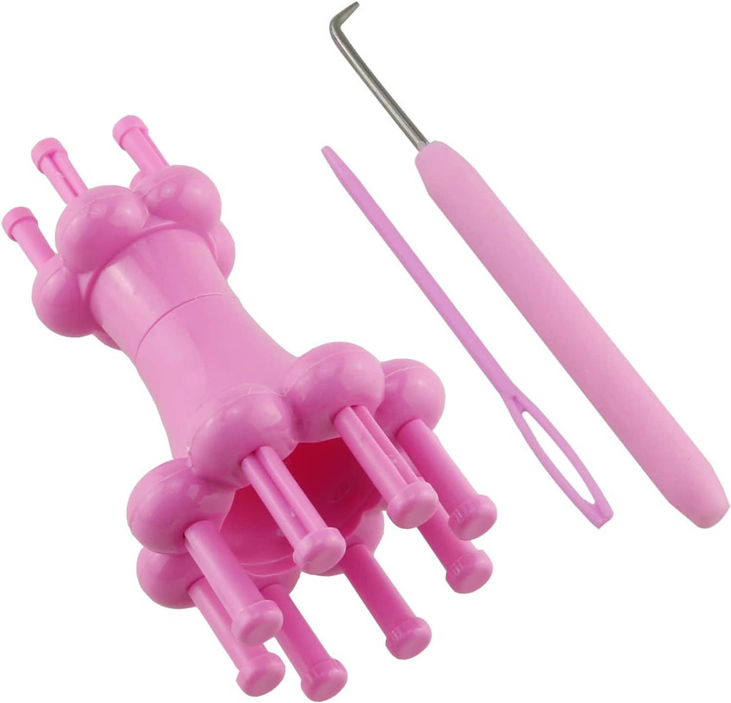 Pink knitting loom tool set with metal hook and two plastic yarn guides, close-up