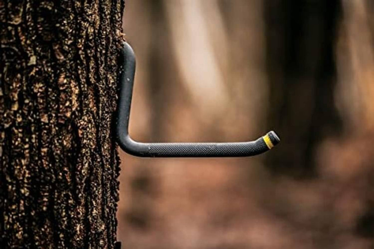 Tree step tool on bark with textured handle and yellow self-tapping screw