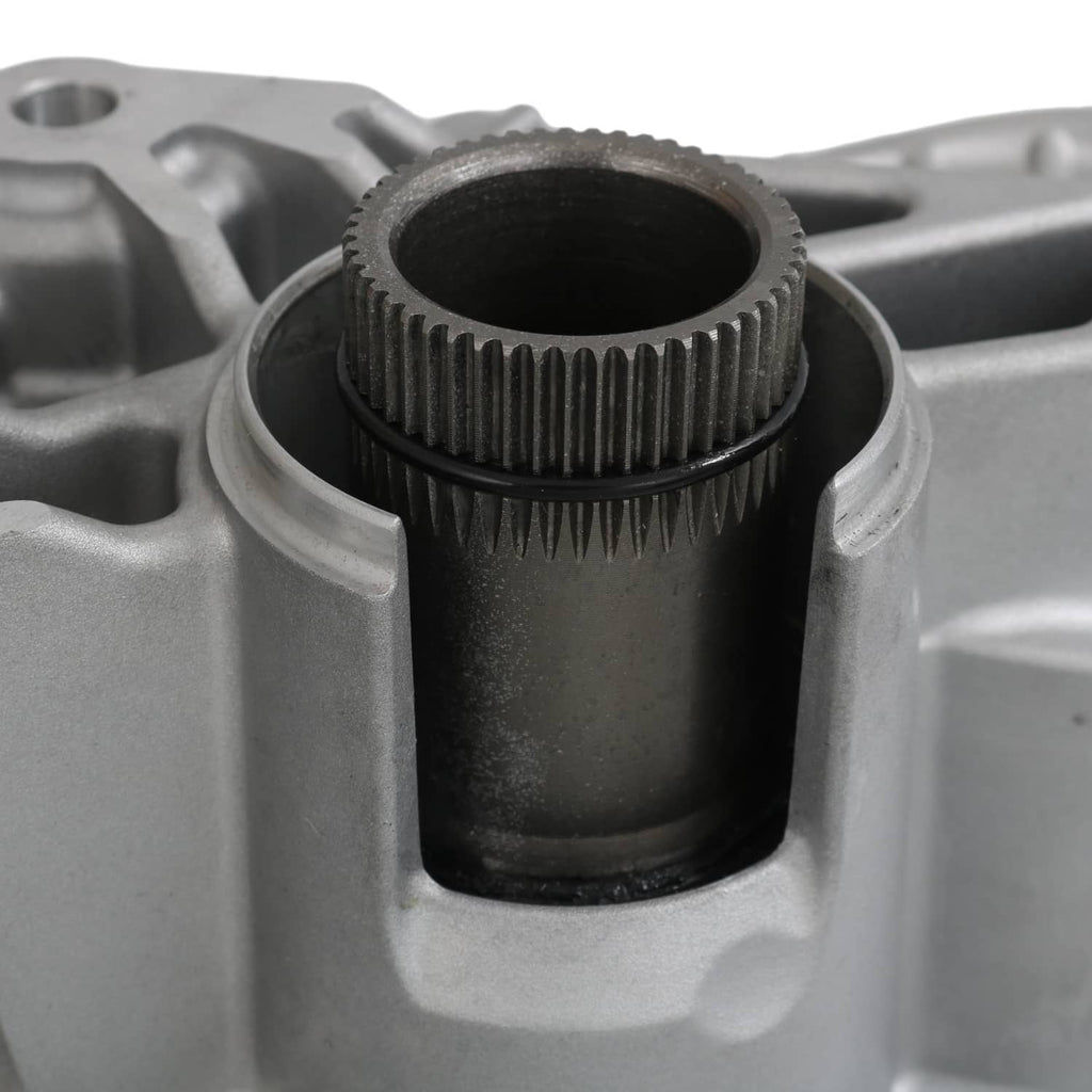 Close-up of transfer case housing with toothed shaft and dark internal opening