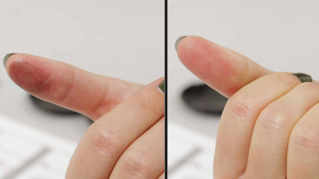 Fingertips with visible fingerprint transfer impression from an inkless pad
