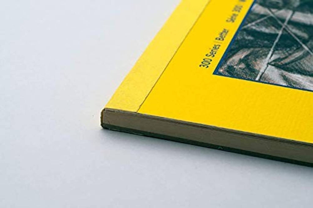 Corner of a yellow tape-bound tracing paper pad with “300 Series” text