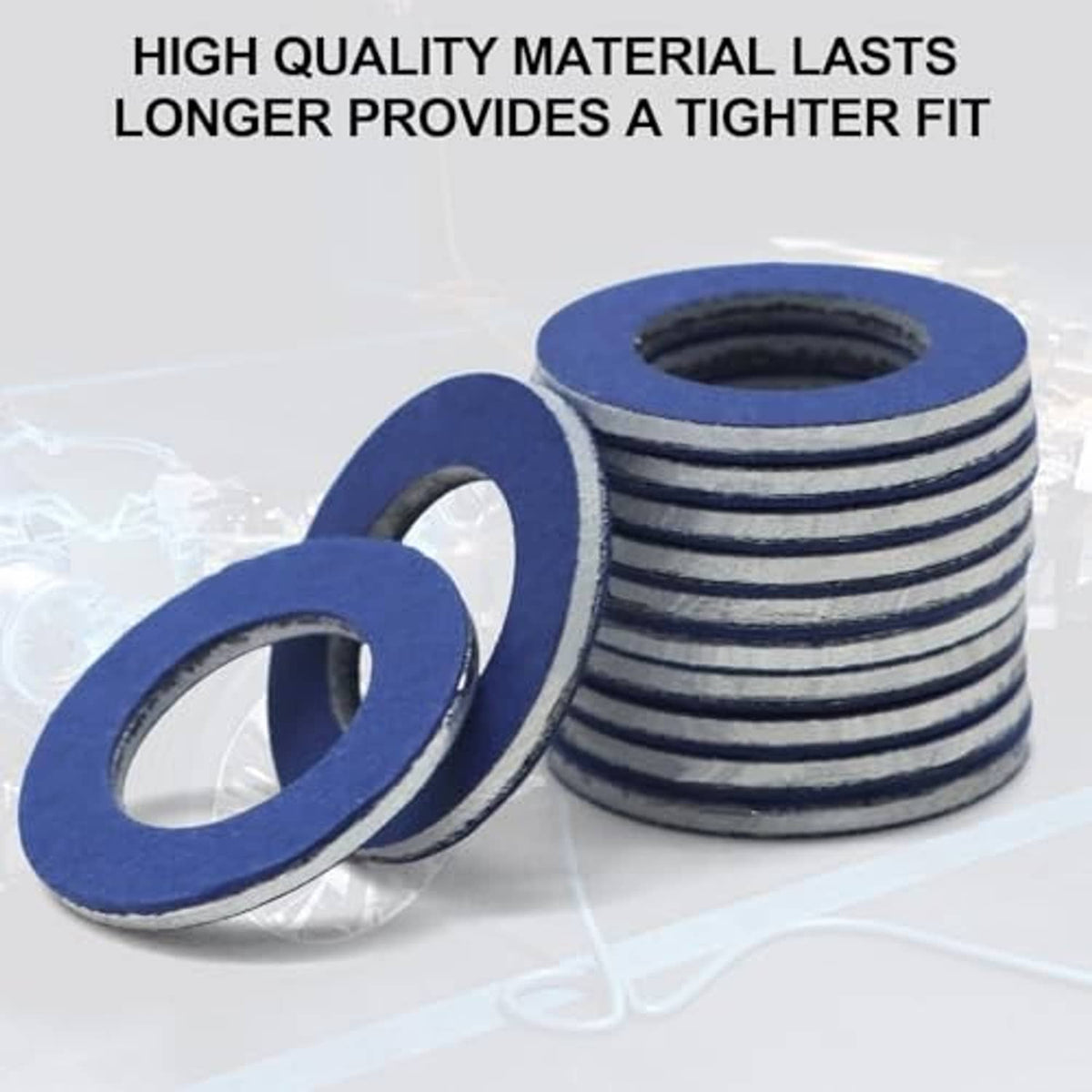 Multiple blue oil drain plug gasket washers with central holes, stacked and loose pieces