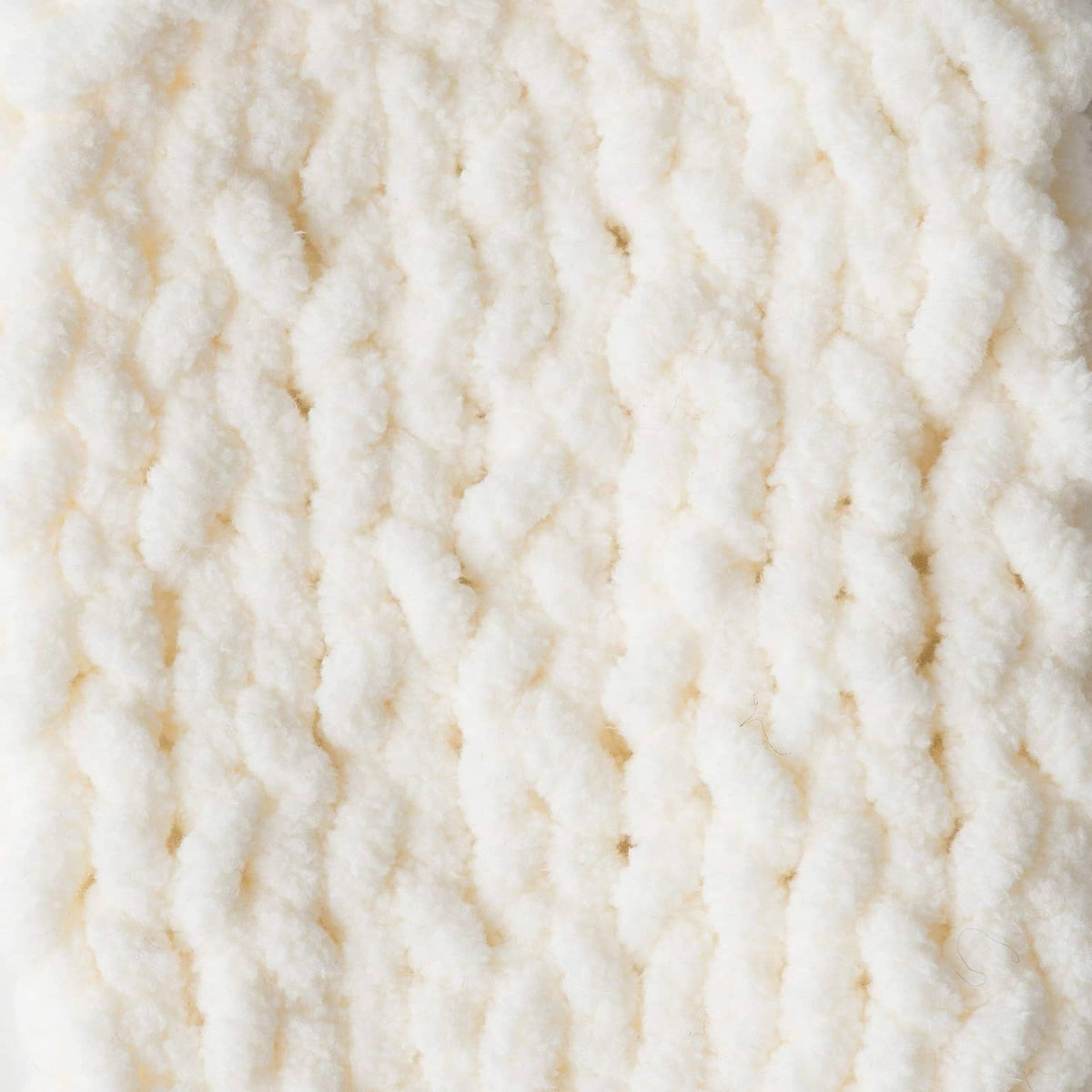 White plush chenille yarn surface, thick looped strands