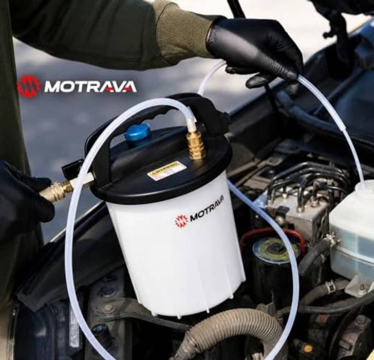 Vacuum brake bleeder canister in engine bay with clear vacuum hose connection