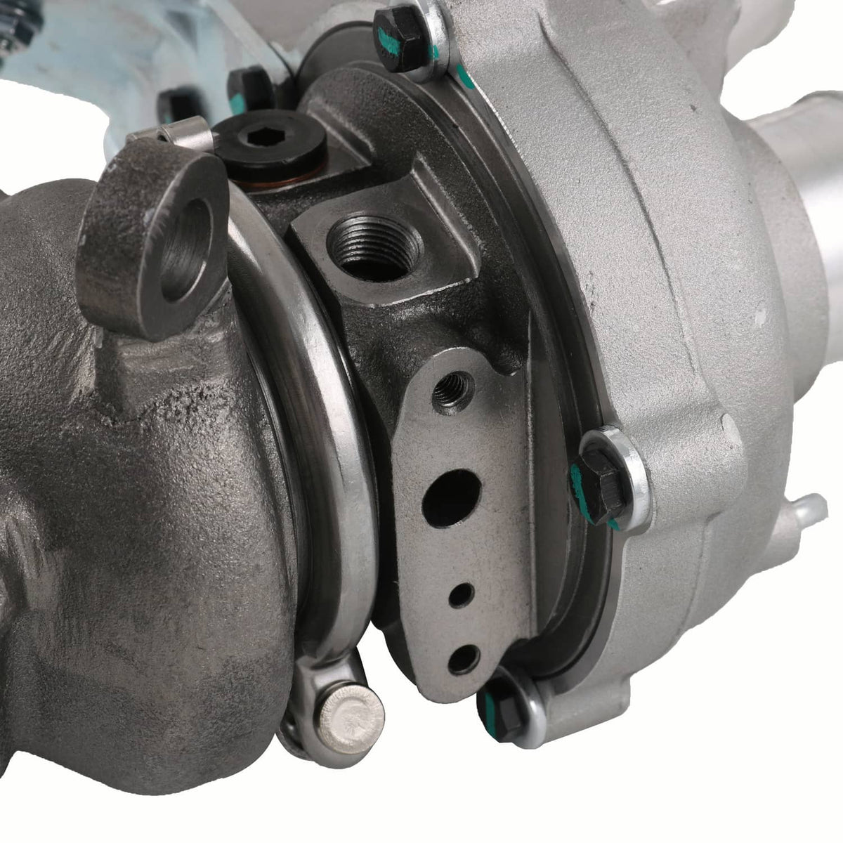 Left-side turbocharger housing close-up with gasket flange and mounting bolts