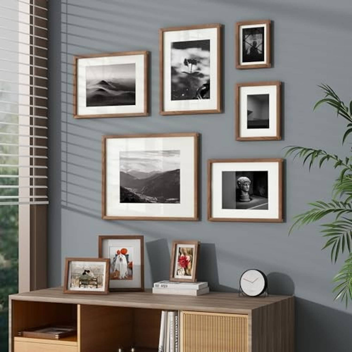 Walnut wood photo frames with white borders and black-and-white prints