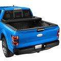 Hard tri-fold truck bed tonneau cover with matte black panels on a blue pickup