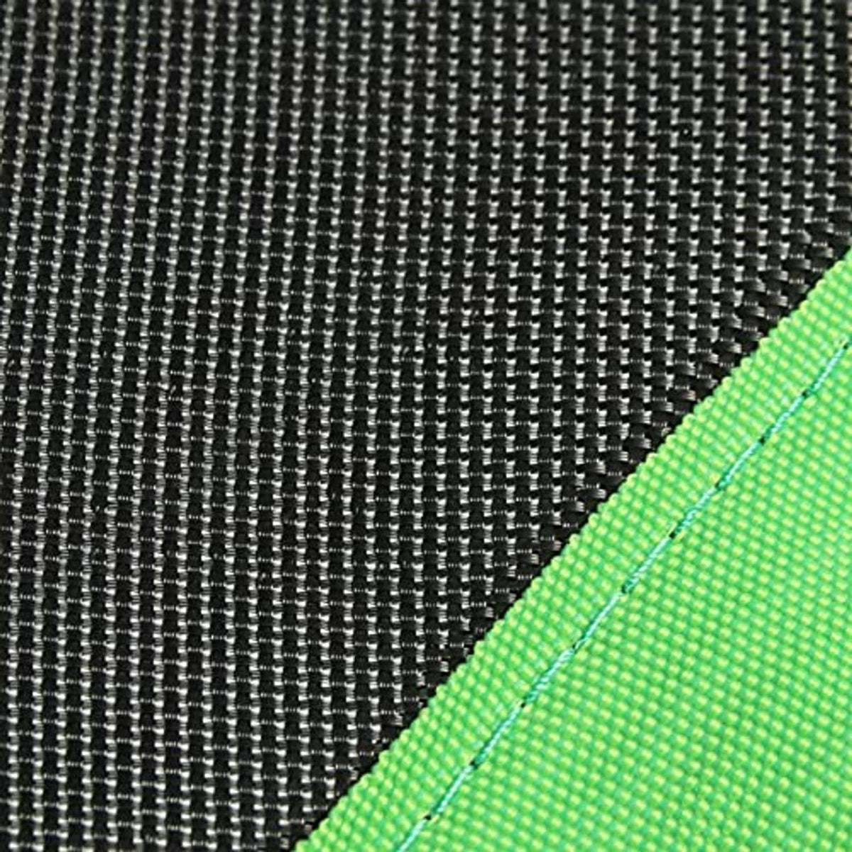 Trampoline mat corner detail with black weave texture and neon green reinforced edge