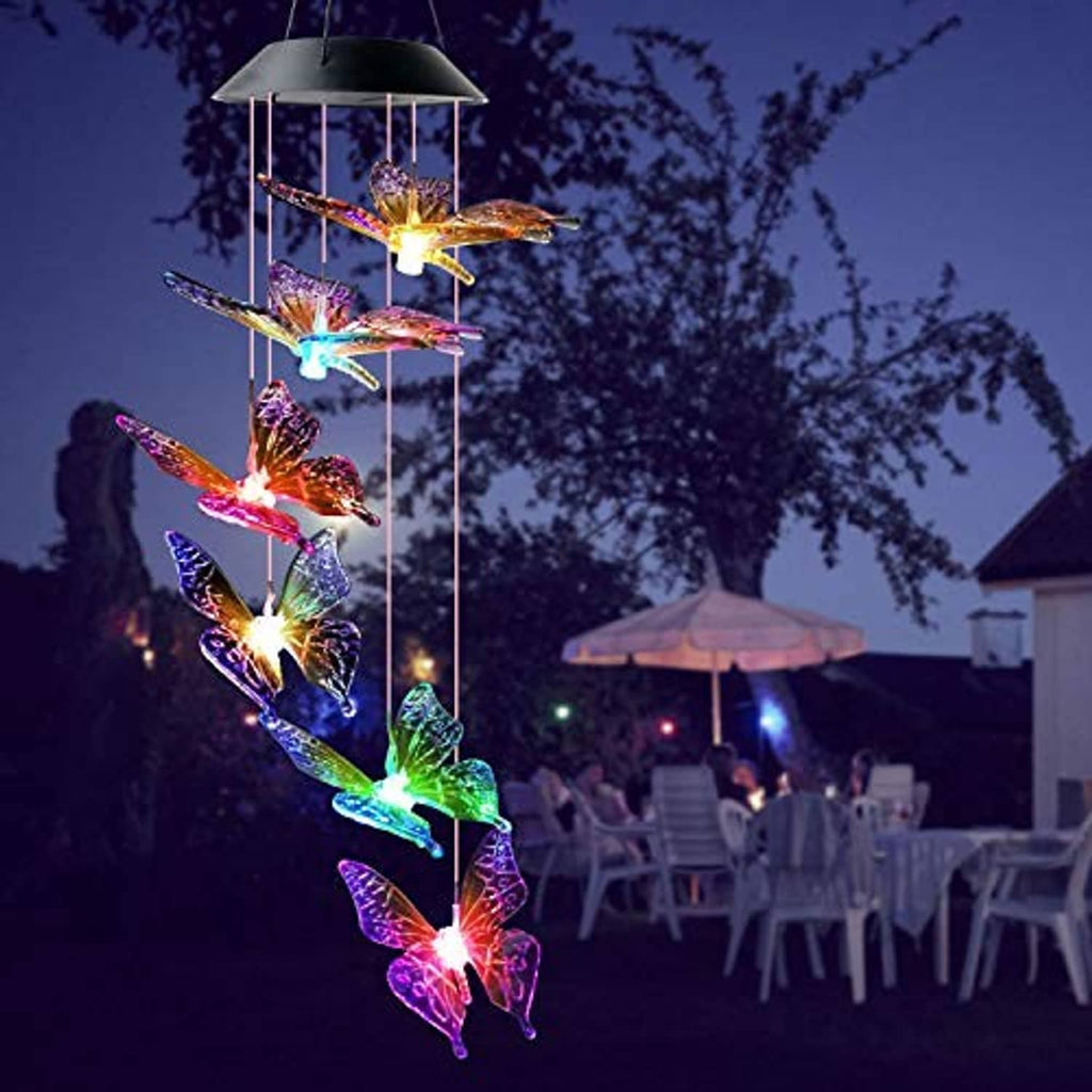 Solar wind chime with multicolored glowing butterfly charms on vertical hanging rods