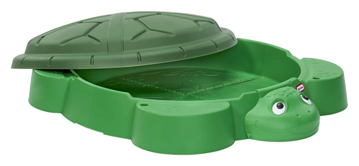Green turtle sandbox with dome lid and turtle face front, cover closed