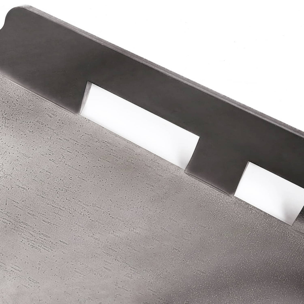 Close-up of steel mount adapter plate with rectangular cutout openings