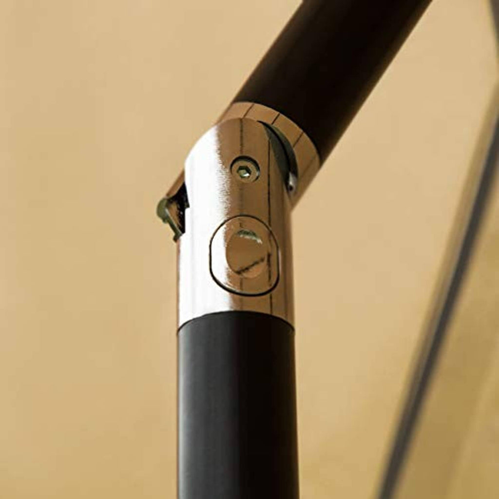 Umbrella push-button lift mechanism on black pole with tan canopy edge