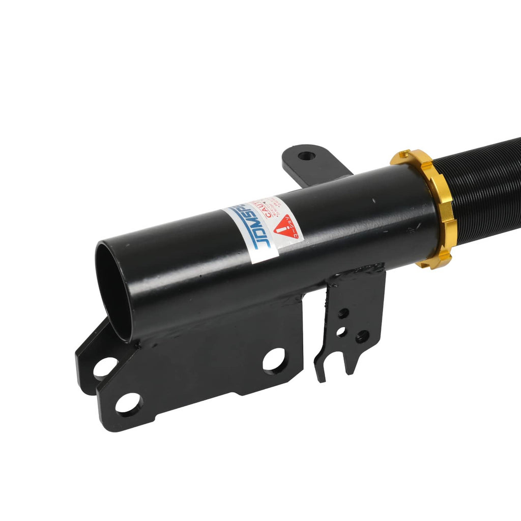 Black coilover suspension strut with red spring and gold height adjust ring