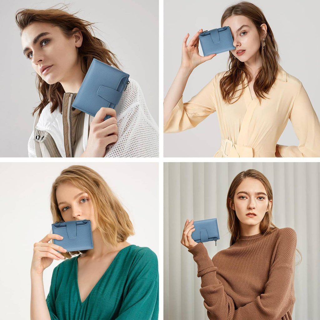 Sky blue mini bifold wallet in model hands with front flap tab and zipper closure