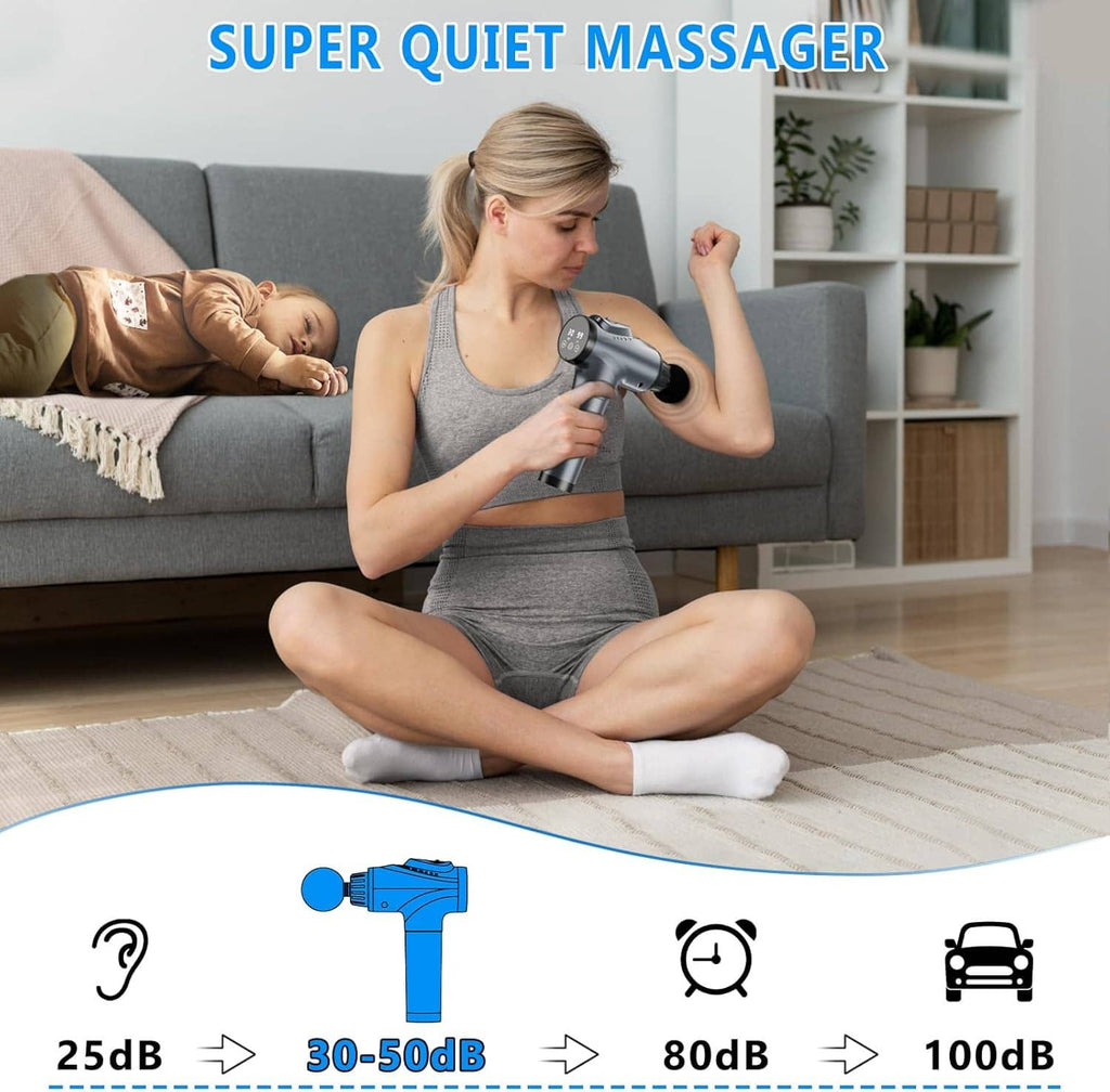 Handheld electric massage gun in use on shoulder with round massage head attachment