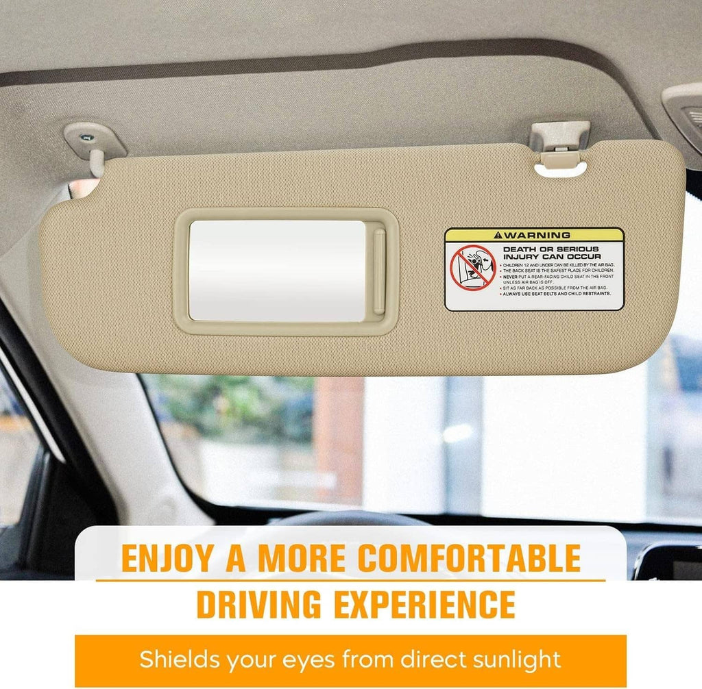 Beige car sun visor with rectangular mirror window and mounting clips, close-up