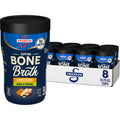 Swanson sipping bone broth container, chicken ginger-turmeric, navy label with gold accents