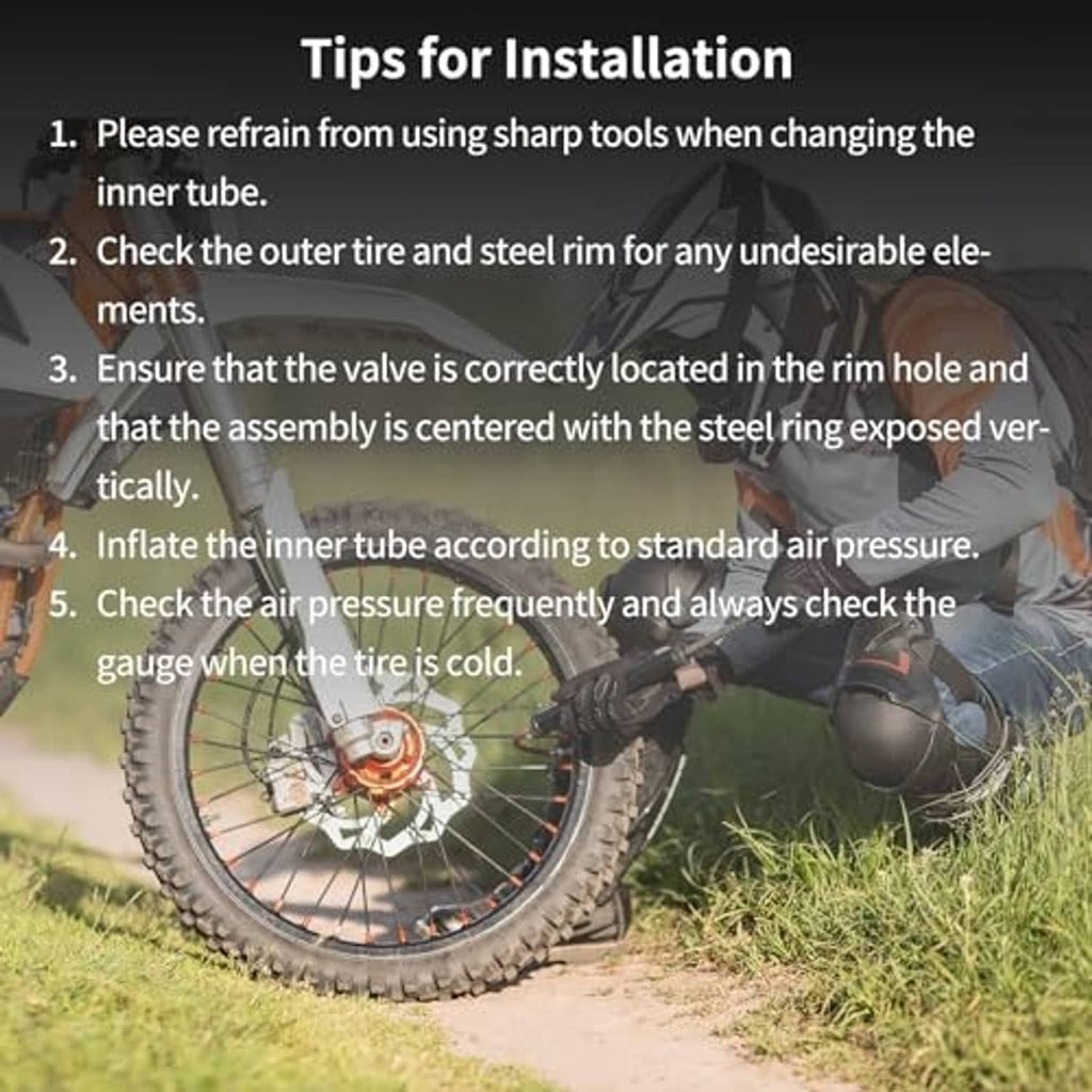 Motorcycle inner tube installation scene with dirt bike wheel outdoors
