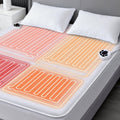 White heated mattress pad with glowing multi-zone heating lines