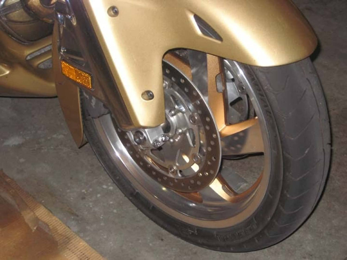 Motorcycle front wheel with chrome fender, disc brake, and alloy rim